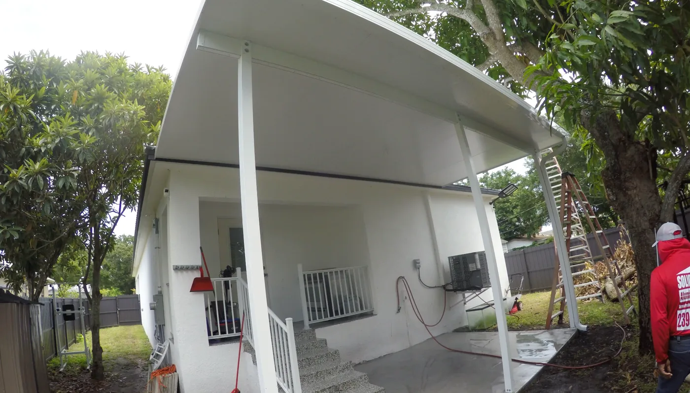 Finished insulated aluminum patio roof and concrete patio built by Solid Makers in Clewiston Florida