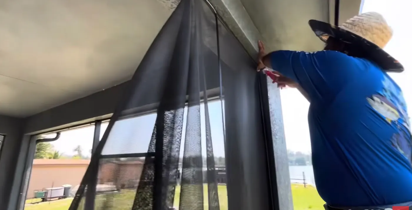 Solid Makers installing screen mesh on a custom screen lanai in Clewiston, Florida