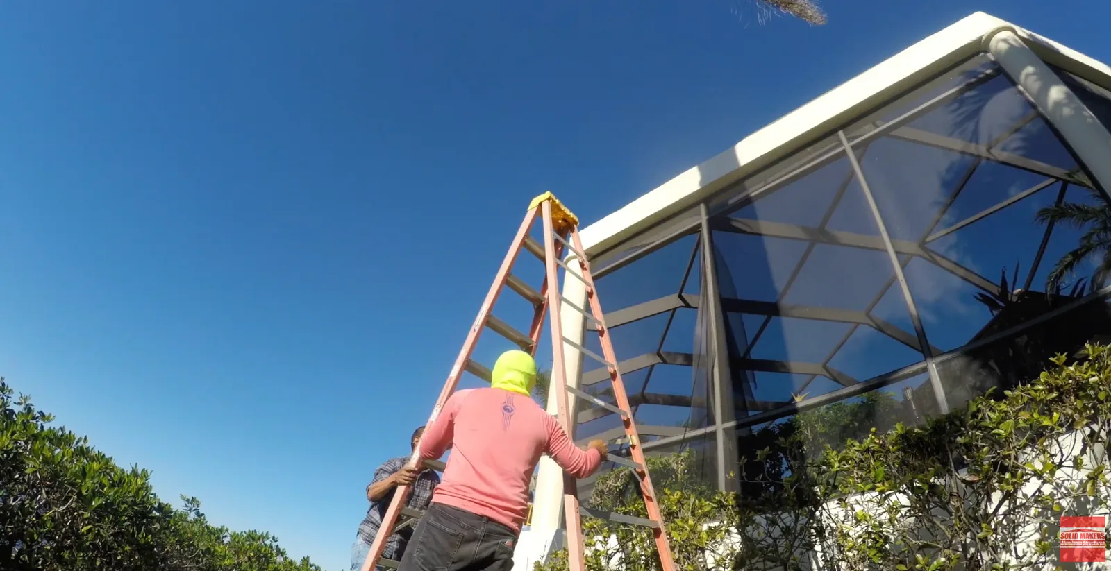 Crew working on a pool cage rescreen and repair in Fort Myers Florida