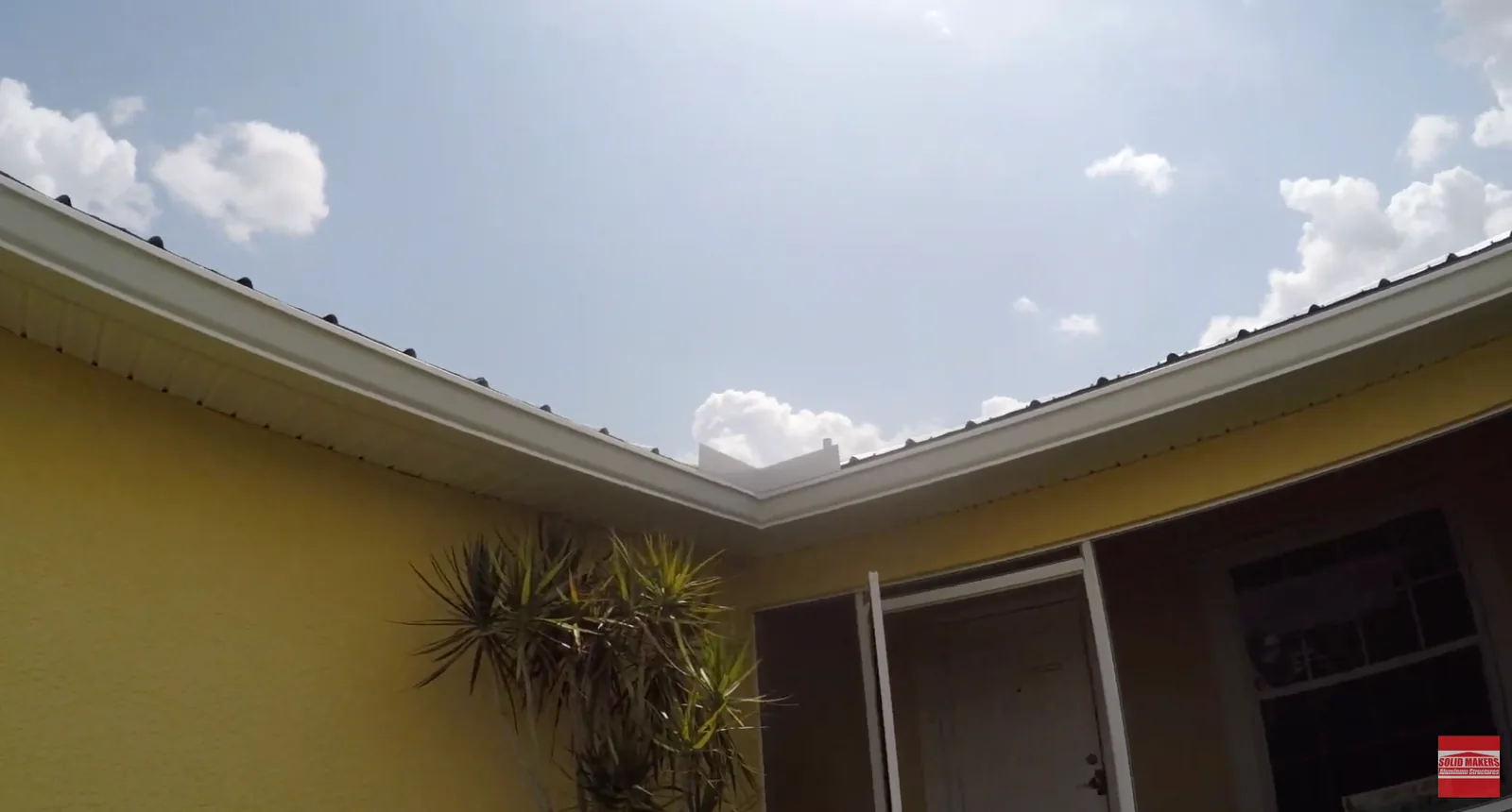 Seamless gutter inside corner and roof valley on LaBelle Florida home