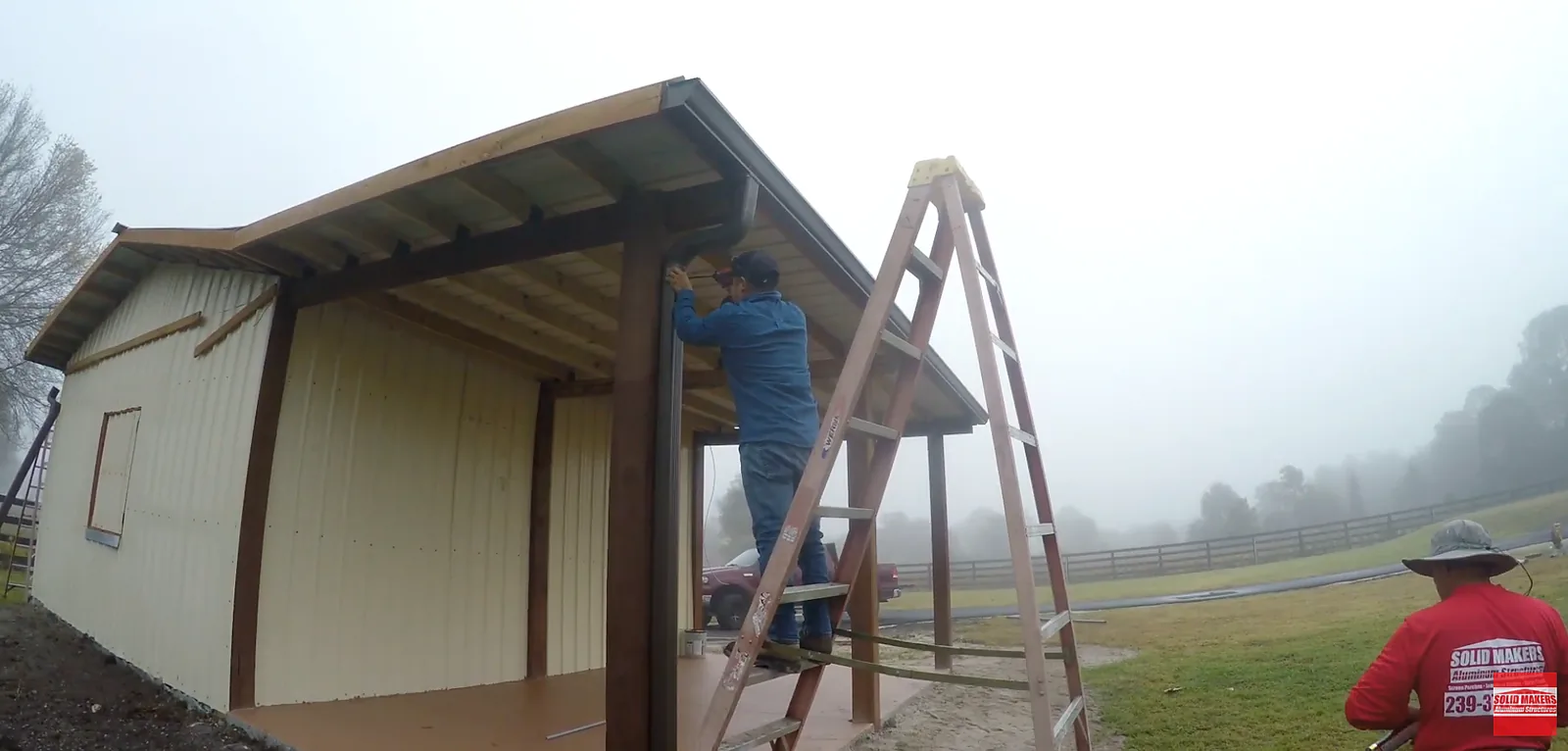 Solid Makers installing gutter and downspout on a barn in Montura Florida near Clewiston