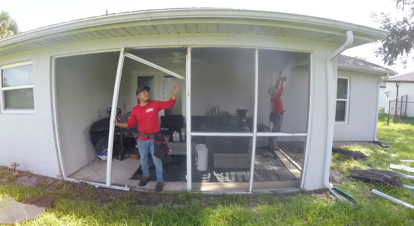Solid Makers crew tearing down a poorly installed screen lanai in Port LaBelle Florida