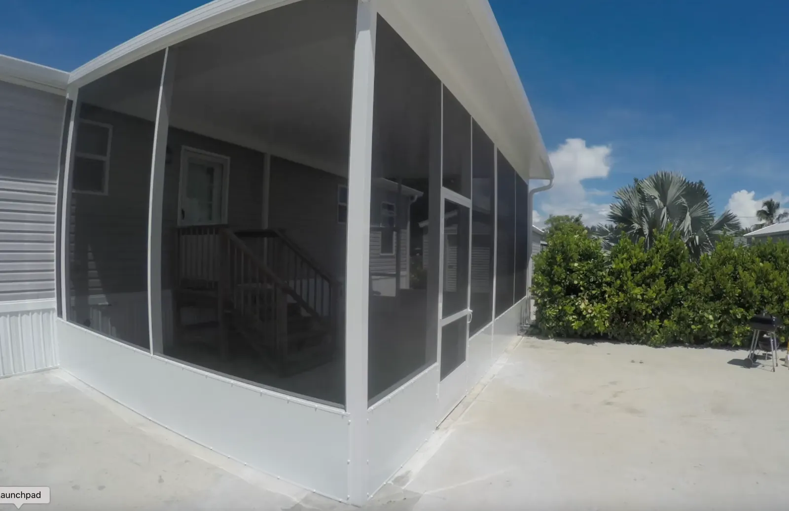 Finished screen porch and carport with insulated roof in Clewiston Florida