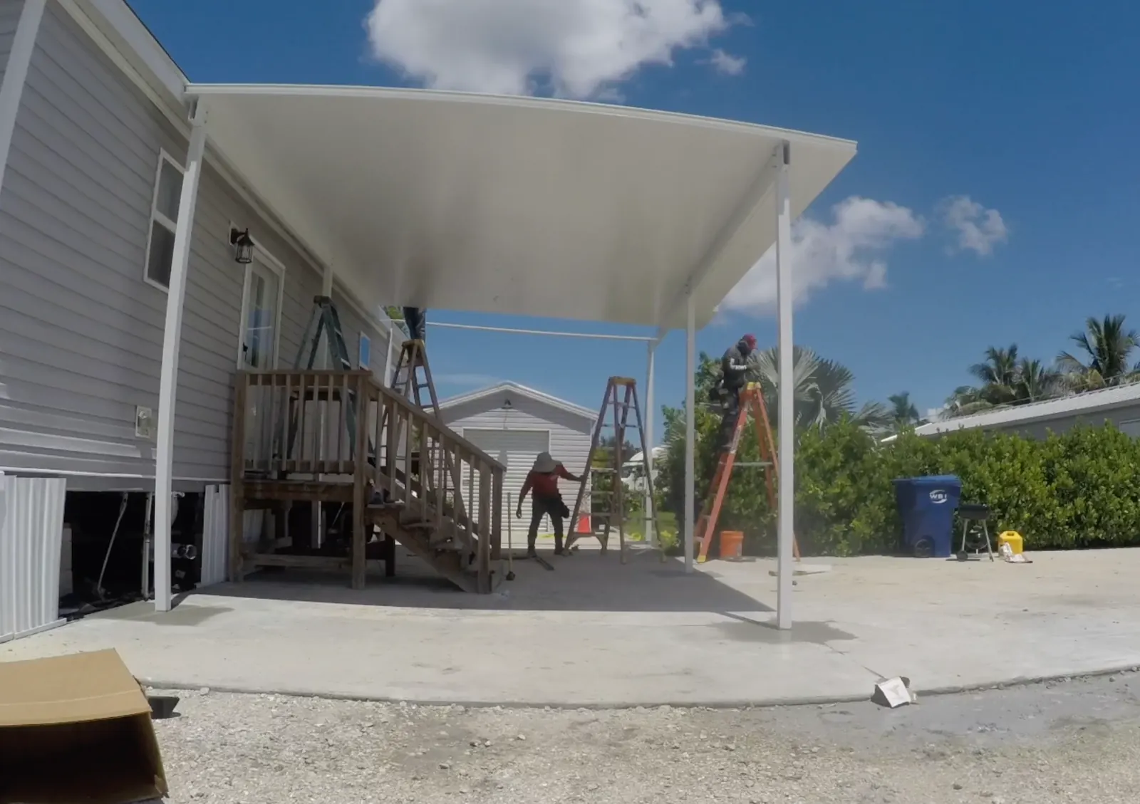 Three inch insulated aluminum roof panels being installed on Clewiston screen porch