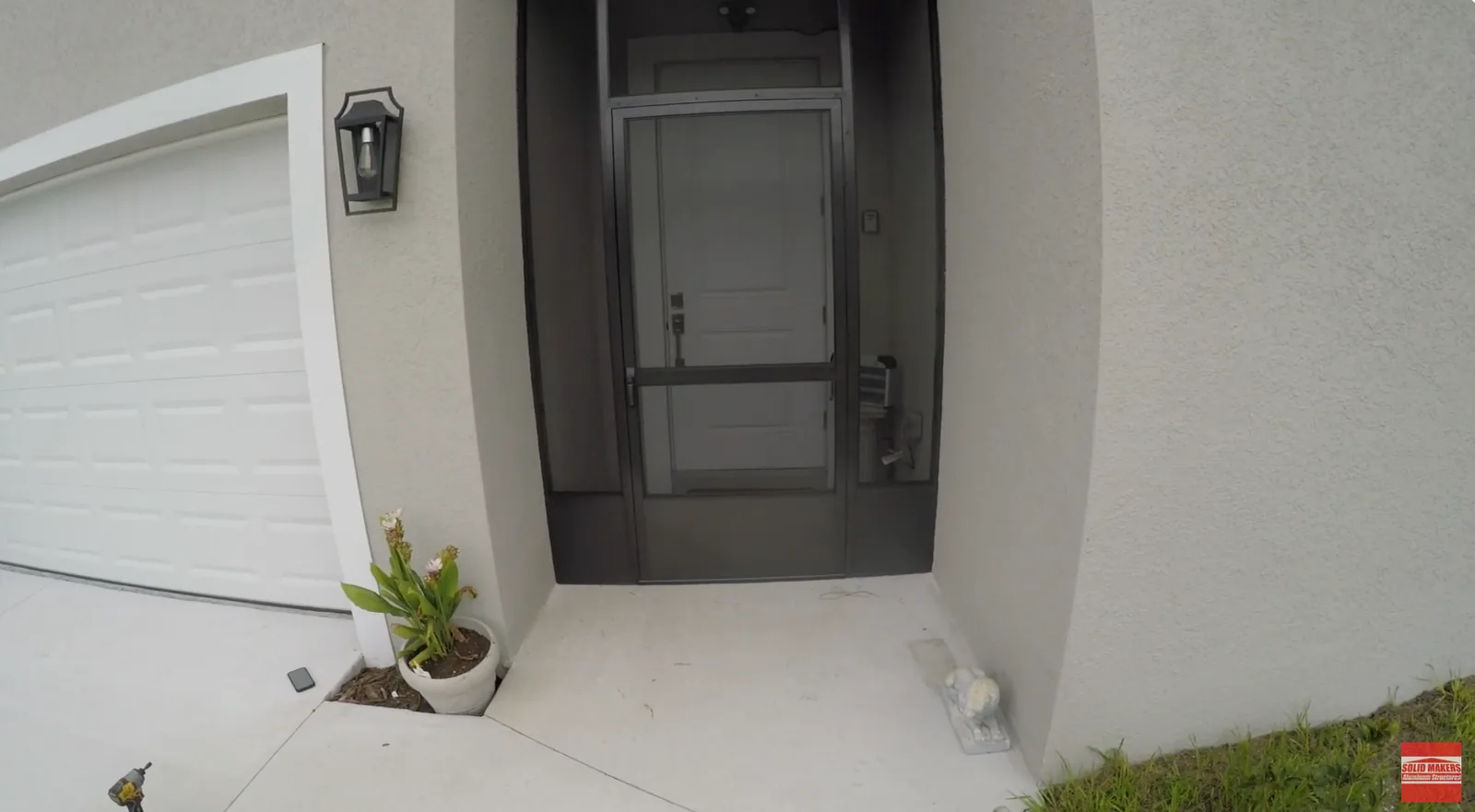 Screened front entry enclosure with bronze aluminum in LaBelle Florida