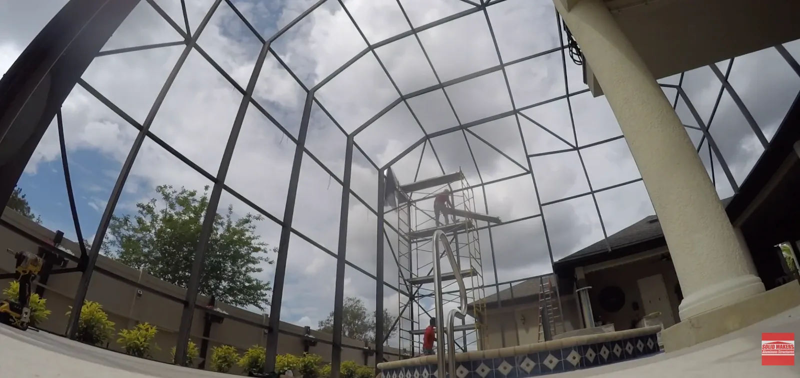 Scaffolding used to repair a tall pool cage in Lehigh Acres Florida